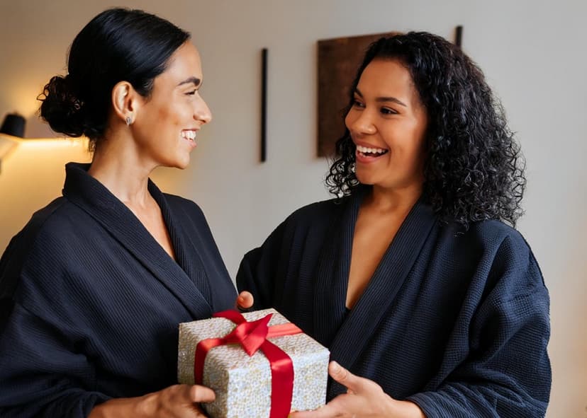 woman-giving-friend-a-spa-gift woman giving her friend a gift at spavia day spa